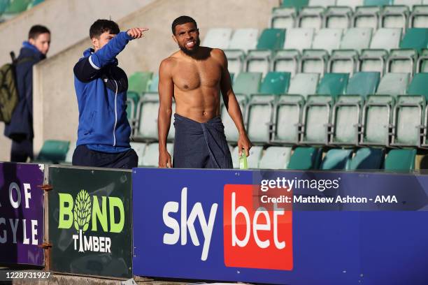 Scott Golbourne of Shrewsbury Town receives directions on where to take a shower after the match with the away dressing room in a make shift location...