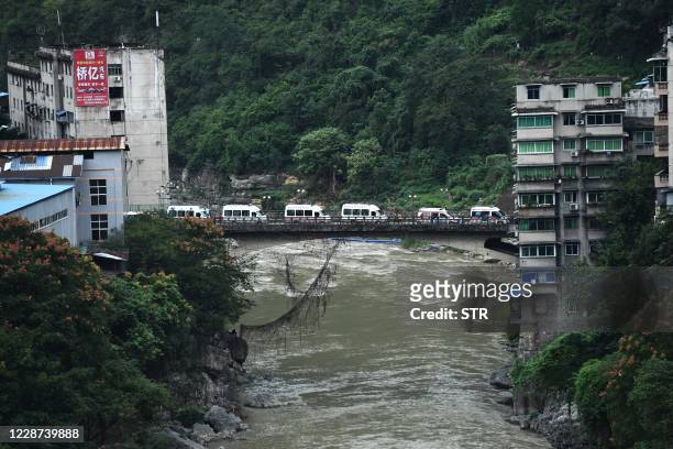Ambulances wait outside the Songzao Coal Mine near Chongqing, in southwest China on September 27, 2020. - Sixteen workers died and one is in a...