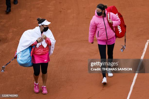 Belarus' Victoria Azarenka and Montenegro's Danka Kovinic come back to the pitch for their women's singles first round tennis match at the Suzanne...