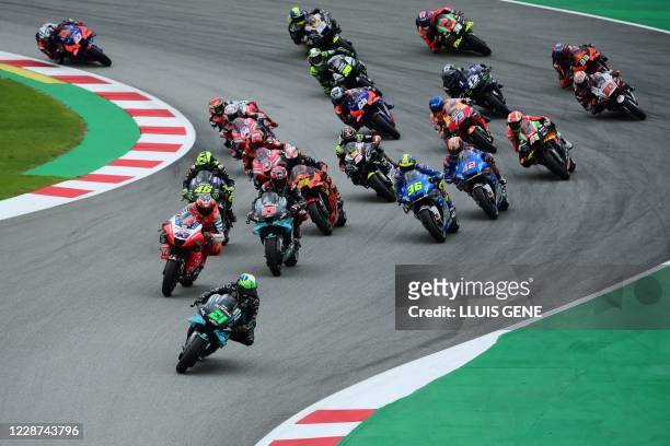 Petronas Yamaha SRT' Italian rider Franco Morbidelli leads after the start of the MotoGP race of the Moto Grand Prix de Catalunya at the Circuit de...
