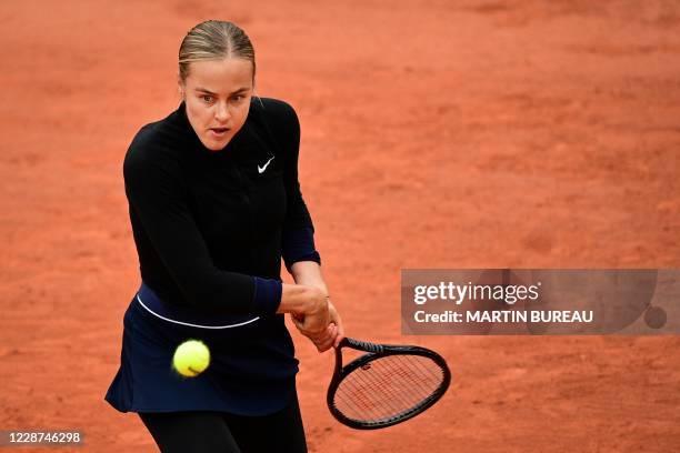 Slovakia's Anna Karolina Schmiedlova returns the ball to Venus Williams of the US during their women's singles first round tennis match at the...