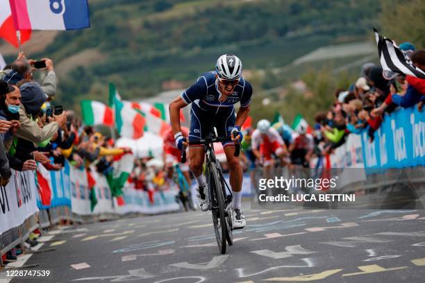 France's Julian Alaphilippe rides during his breakaway on his way to win the Men's Elite Road Race, a 258.2-kilometer route around Imola,...