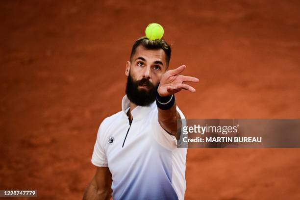 France's Benoit Paire eyes the ball as he serves to South Korea's Kwon Soon-woo during their men's singles first round tennis match on Day 1 of The...