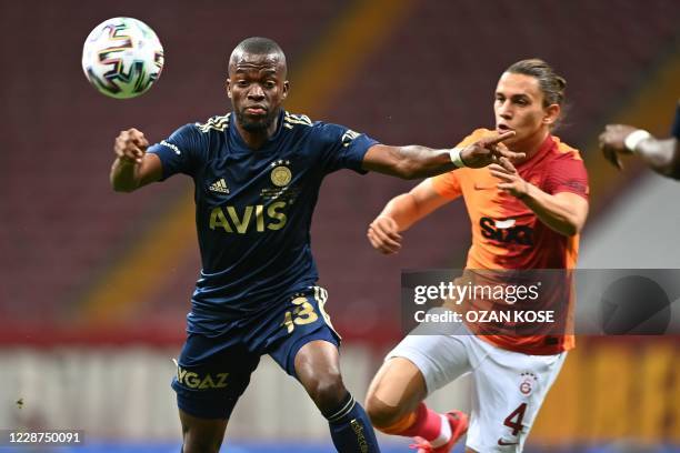 Fenerbahce's Ecuadorian forward Enner Valencia vies for the ball with Galatasaray's Turkish midfielder Taylan Antalyali during the Turkish Super Lig...