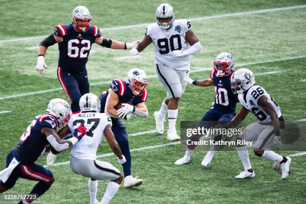 Rex Burkhead of the New England Patriots runs the ball against the Las Vegas Raiders in the first half at Gillette Stadium on September 27, 2020 in...