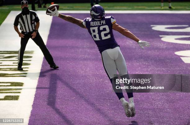 Kyle Rudolph of the Minnesota Vikings catches the ball with one hand for a touchdown in the fourth quarter of the game against the Tennessee Titans...