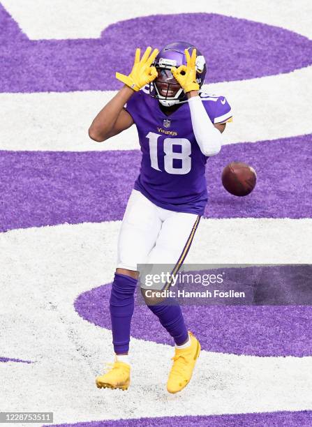 Justin Jefferson of the Minnesota Vikings celebrates a touchdown against the Tennessee Titans during the third quarter of the game at U.S. Bank...