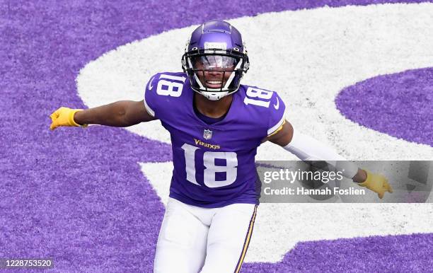 Justin Jefferson of the Minnesota Vikings celebrates a touchdown against the Tennessee Titans during the third quarter of the game at U.S. Bank...