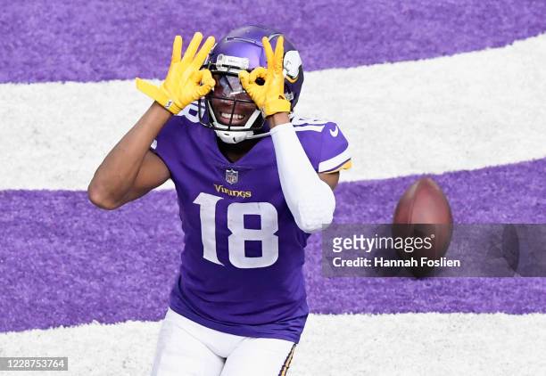 Justin Jefferson of the Minnesota Vikings celebrates a touchdown against the Tennessee Titans during the third quarter of the game at U.S. Bank...