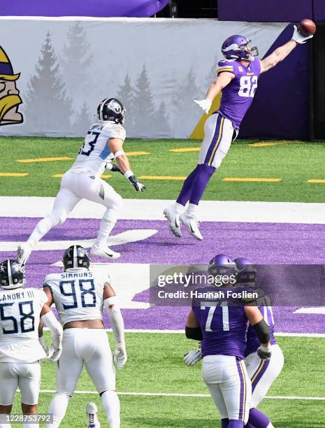 Kyle Rudolph of the Minnesota Vikings makes a catch for a touchdown against Will Compton of the Tennessee Titans during the fourth quarter of the...