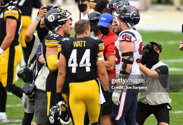 Watt, Derek Watt of the Pittsburgh Steelers and J.J. Watt of the Houston Texans talk after Pittsburgh's 28-21 win at Heinz Field on September 27,...