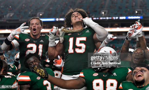 Miami lineman Jaelan Phillips displays the tunover chain after intercepting a Florida State pass during the first half of their game on Saturday,...
