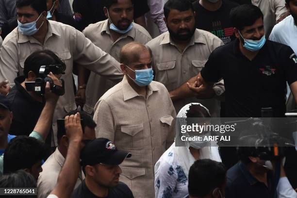 Shahbaz Sharif , Pakistani opposition leader and brother of former prime minister Nawaz Sharif, comes out from the high court after the court...