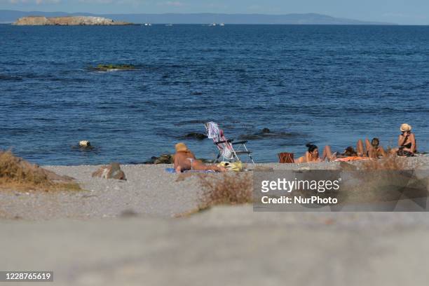 Group of holiday makers seen on a rocky beach in Sozopol. On Sunday, September 27 in Sozopol, Burgas Province, Poland.
