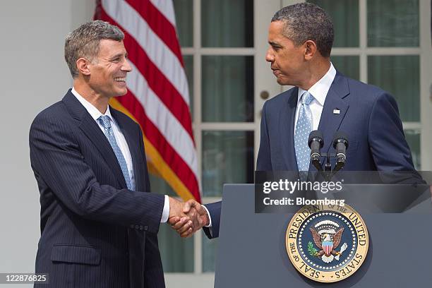 Alan Krueger, nominee to lead the White House Council of Economic Advisers, left, shakes hands with U.S. President Barack Obama after announcing his...