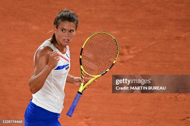 France's Chloe Paquet reacts during her women's singles first round tennis match against France's Alize Cornet on Day 2 of The Roland Garros 2020...