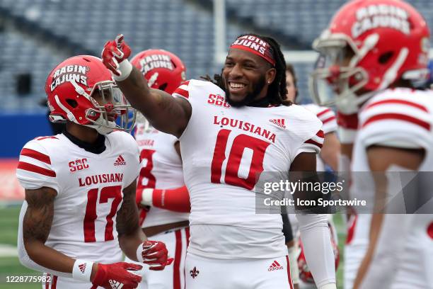 Louisiana-Lafayette Ragin Cajuns linebacker Andre Jones waves to the crowd before the game between Georgia State Panthers and Louisiana-Lafayette...
