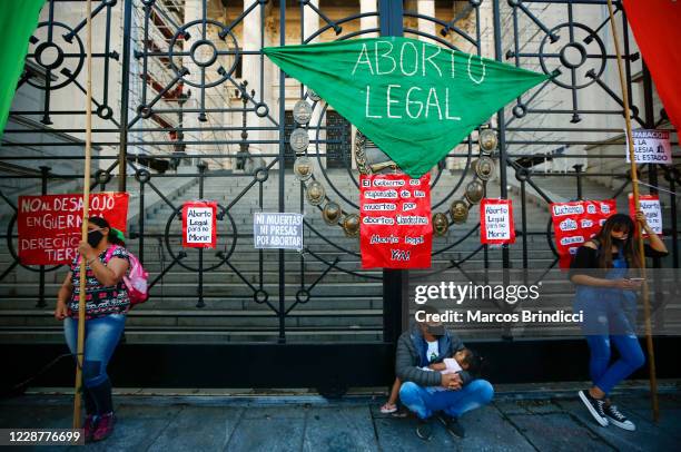 Man holds a child outside the Congress during a demonstration in favor of decriminalization of abortion on the International Safe Abortion Day on...