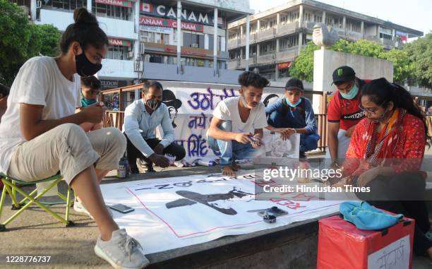 Members of RYA-Y4S make a banner featuring Bhagat Singh to commemorate his birth anniversary as Employment Rights Day at Sector 17 Plaza on September...