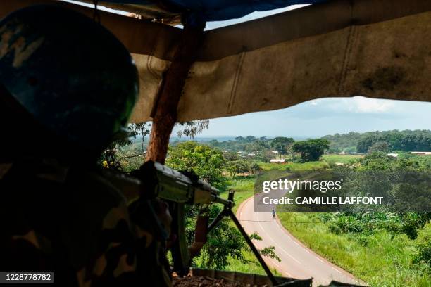 An United Nations Bangladeshi soldier part of MINUSCA guarding the RN1 road in Baboua, Central African Republic, on September 22, 2020. - The 3R...