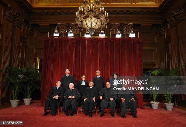 JUstices of the US Supreme Court pose for their official photo on September 29, 2009 at the Supreme Court in Washington,DC. Font row L-R:Anthony...