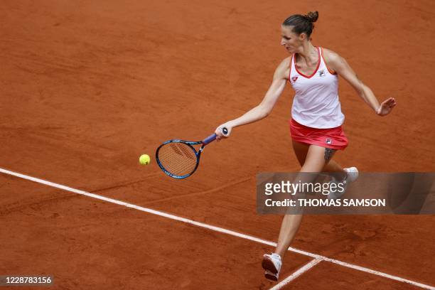 Czech Republic's Karolina Pliskova returns the ball to Egypt's Mayar Sherif during their women's singles first round tennis match on Day 3 of The...