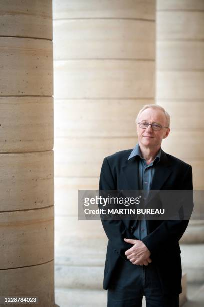 Israel's novelist David Grossman poses for photographers in front of the Odeon Theatre after been been awarded with the Foreign Medicis prize for...