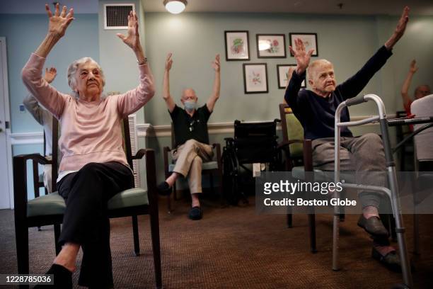 Residents take part in a yoga class at an assisted living facility in Boston, MA on September 02, 2020. In the Commonwealth’s senior care sites, the...