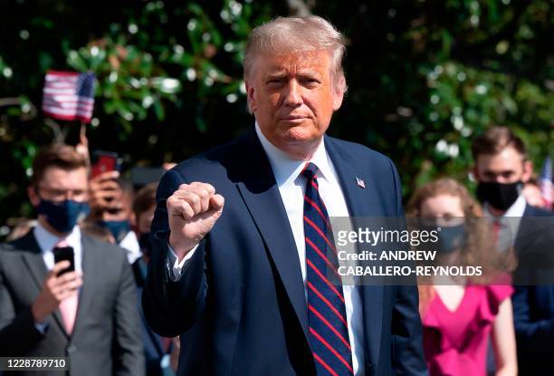 President Donald Trump gestures as he speaks to the press before walking to Marine One to depart from the South Lawn of the White House in...