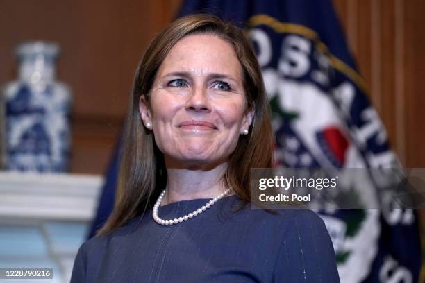 Seventh U.S. Circuit Court Judge Amy Coney Barrett, President Donald Trump's nominee for the U.S. Supreme Court, meets with Sen. John Thune as she...