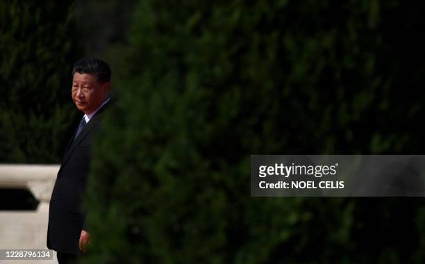 Chinese President Xi Jinping walks to the Monument to the Peoples Heroes during a wreath laying ceremony to honour deceased national heroes on...