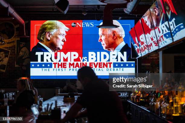 Television screens airing the first presidential debate are seen at Walters Sports Bar on September 29, 2020 in Washington, United States. Americans...