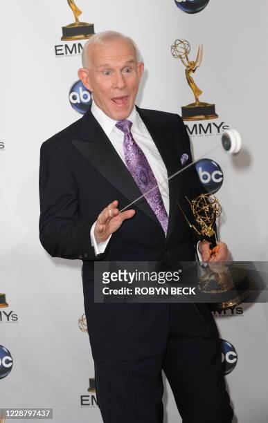 Comedian Tommy Smothers shows off his yo-yo skills in the press room at the 60th Primetime Emmy Awards at the Noika Theatre in Los Angeles on...