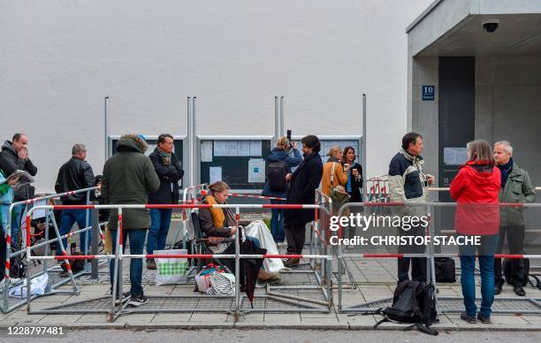 Journalists queue outside court before attending the trial of the former CEO of German car maker Audi AG over the pollution scandal "Dieselgate" at...