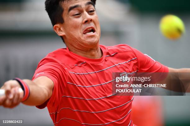 Mackenzie McDonald of the US eyes the ball as he returns it to Spain's Rafael Nadal during their men's singles second round tennis match on Day 4 of...