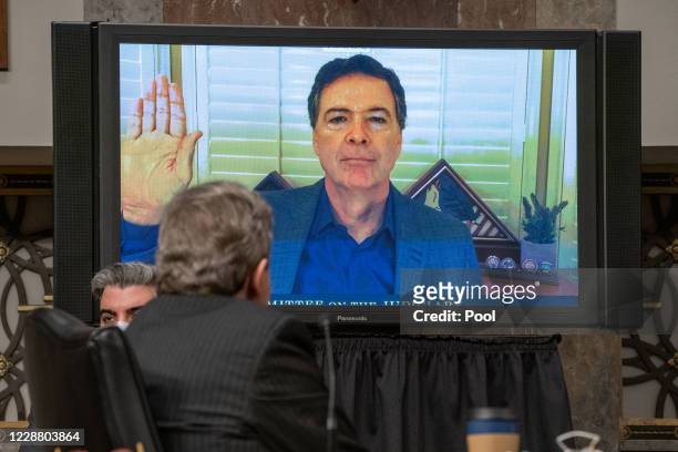 Former FBI Director James Comey is sworn in remotely at a hearing of the Senate Judiciary Committee on September 30, 2020 in Washington, DC. Comey...