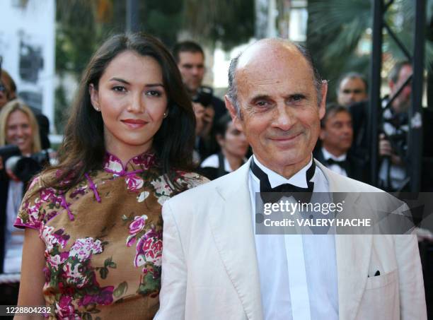 French actor and singer Guy Marchand poses 22 May 2007 as he arrives with his wife Adelina at the Festival Palace in Cannes, southern France, for the...