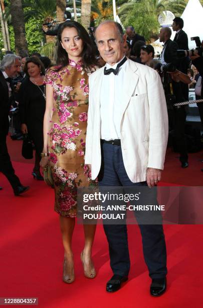 French actor and singer Guy Marchand poses 22 May 2007 as he arrives with his wife Adelina at the Festival Palace in Cannes, southern France, for the...