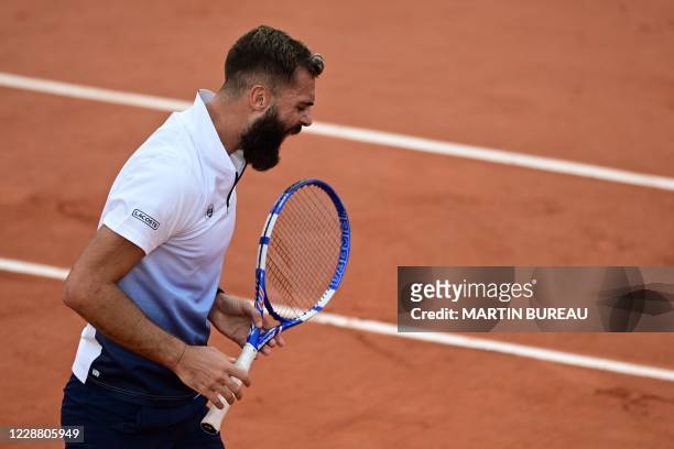 France's Benoit Paire reacts during the men's singles second round tennis match against Argentina's Federico Coria on Day 4 of The Roland Garros 2020...