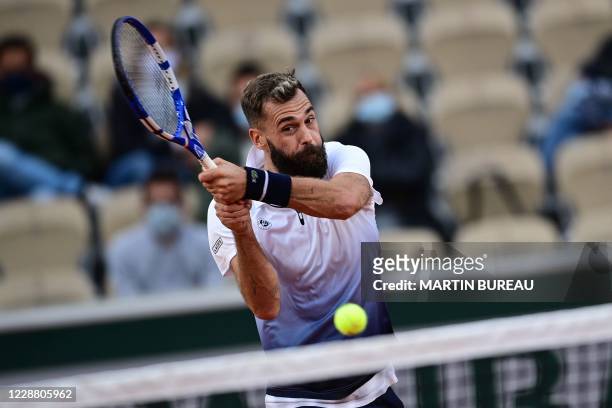 France's Benoit Paire returns the ball to Argentina's Federico Coria during their men's singles second round tennis match on Day 4 of The Roland...