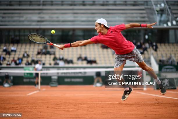 Argentina's Federico Coria returns the ball to France's Benoit Paire during their men's singles second round tennis match on Day 4 of The Roland...