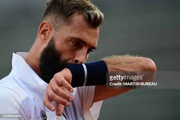 France's Benoit Paire reacts during the men's singles second round tennis match against Argentina's Federico Coria on Day 4 of The Roland Garros 2020...