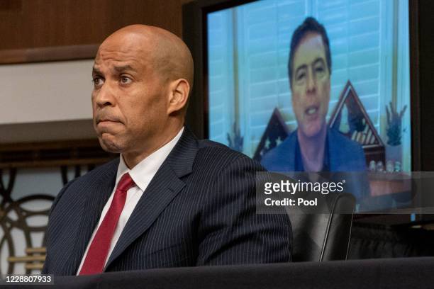 Sen. Cory Booker questions former FBI Director James Comey, who was appearing remotely, at a hearing of the Senate Judiciary Committee on September...