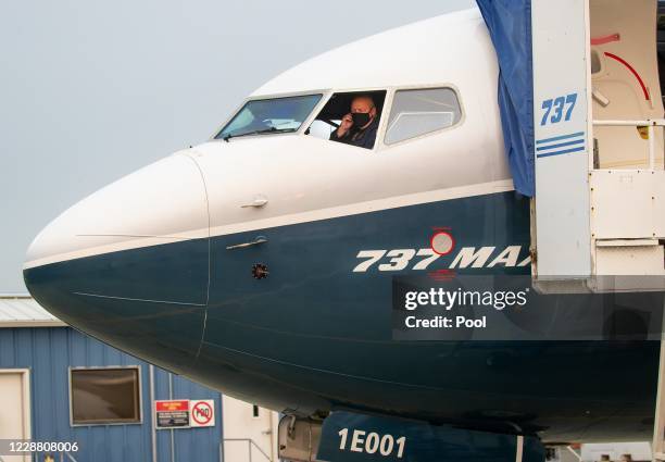 Chief Steve Dickson sitting inside the flight deck of a Boeing 737 MAX, conducting a pre-flight check ahead of take-off from Boeing Field on...