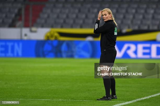 German referee Bibiana Steinhaus is seen on the pitch prior to the German Supercup football match FC Bayern Munich v BVB Borussia Dortmund in Munich,...