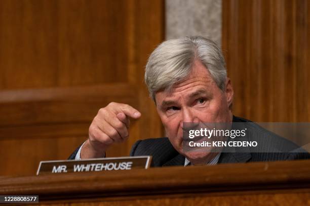 Sen. Sheldon Whitehouse asks questions to James Comey, former Director Of The Federal Bureau Of Investigation as he testifies remotely during the...