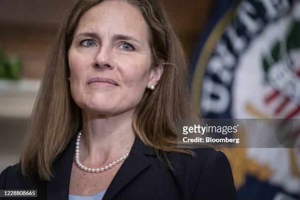 Amy Coney Barrett, U.S. President Donald Trump's nominee for associate justice of the U.S. Supreme Court, listens during a meeting with Senator...