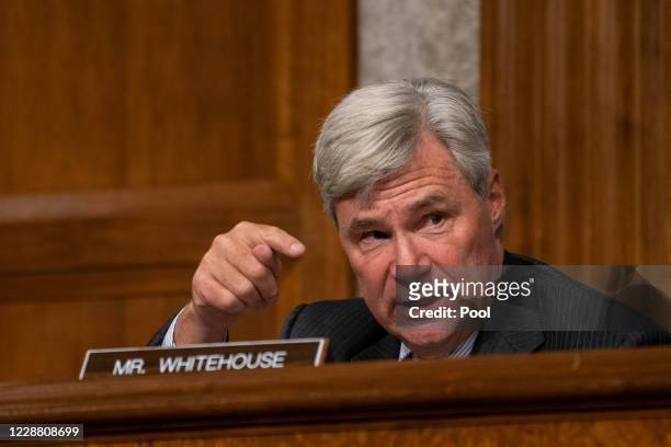Sen. Sheldon Whitehouse questions former FBI Director James Comey, who was appearing remotely, at a hearing of the Senate Judiciary Committee on...