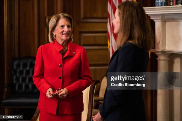 Senator Shelley Moore Capito, a Republican from West Virginia, left, speaks with Amy Coney Barrett, U.S. President Donald Trump's nominee for...