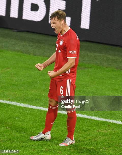 Bayern Munich's Joshua Kimmich celebrates scoring their third goal during the Supercup 2020 match between FC Bayern München and Borussia Dortmund at...